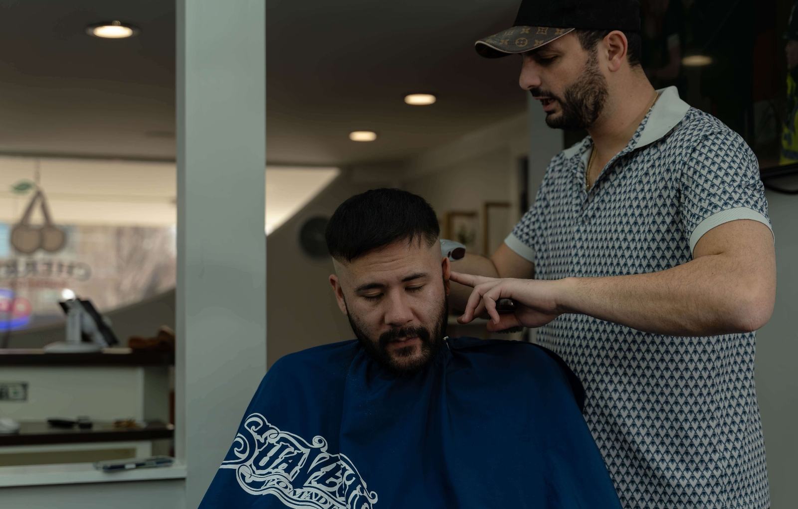 Master barber Edward performing precision fade haircut at Cherry Barbers serving Cherry Creek Denver and Glendale